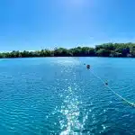 person riding on boat on sea during daytime